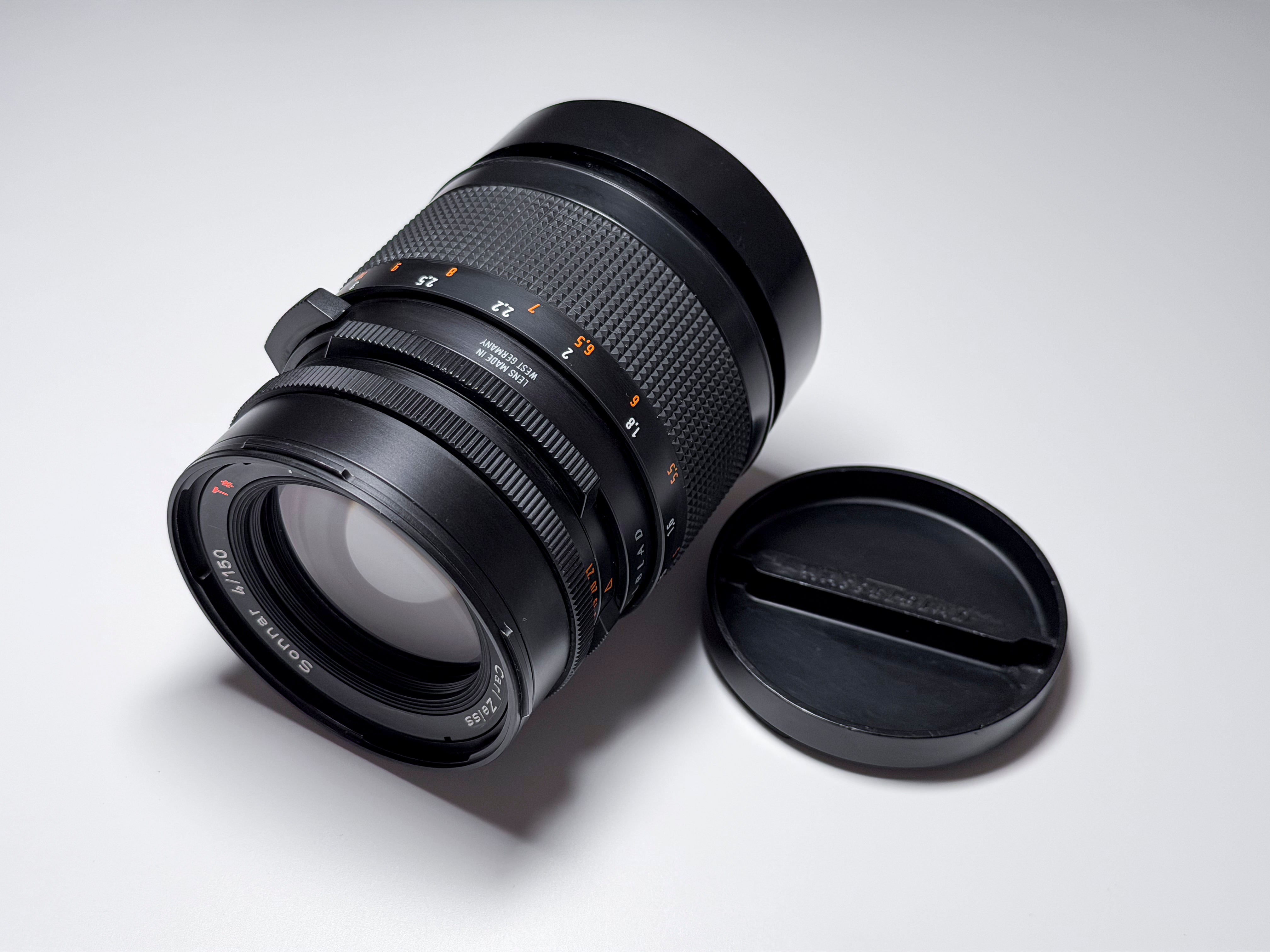Hasselblad 150mm f/4 Sonnar T* CF Lens + Hood and Caps - Excellent, Near Mint