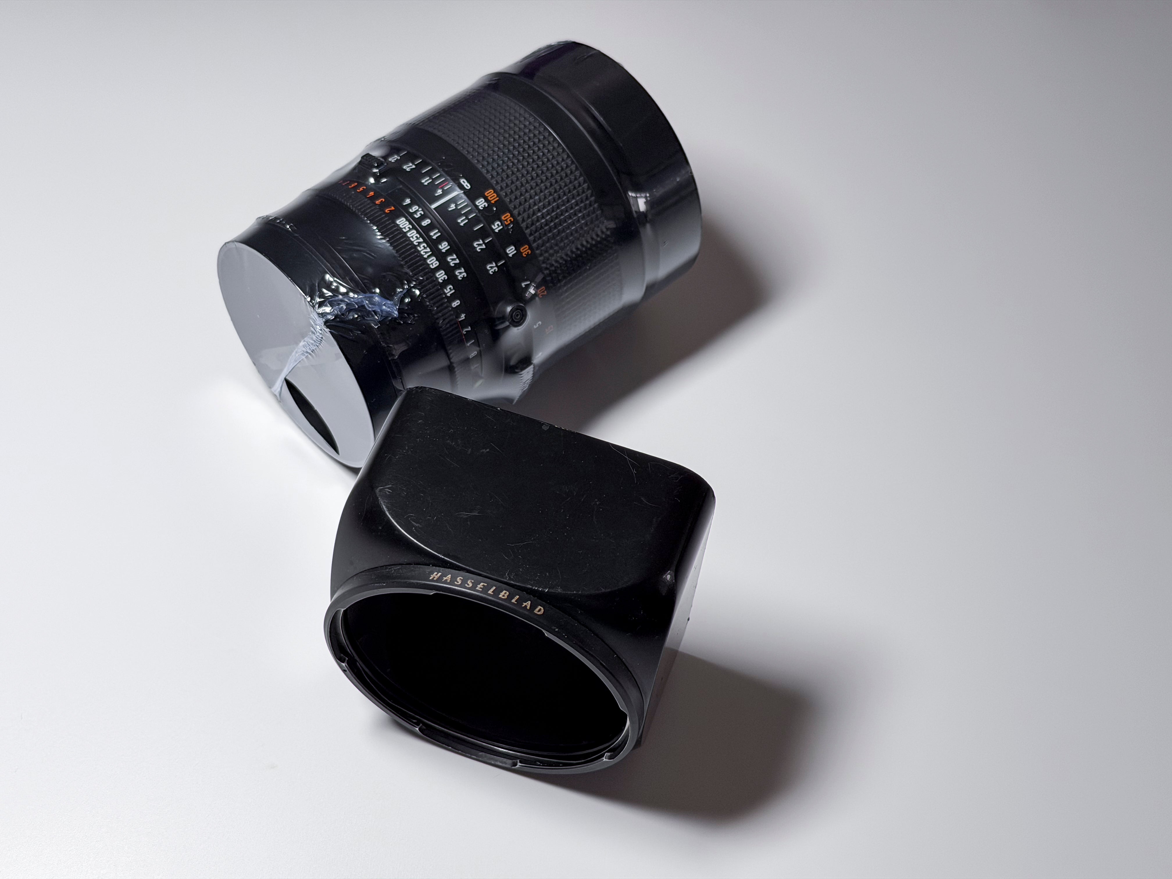 Hasselblad 150mm f/4 Sonnar T* CF Lens + Hood and Caps - Excellent, Near Mint