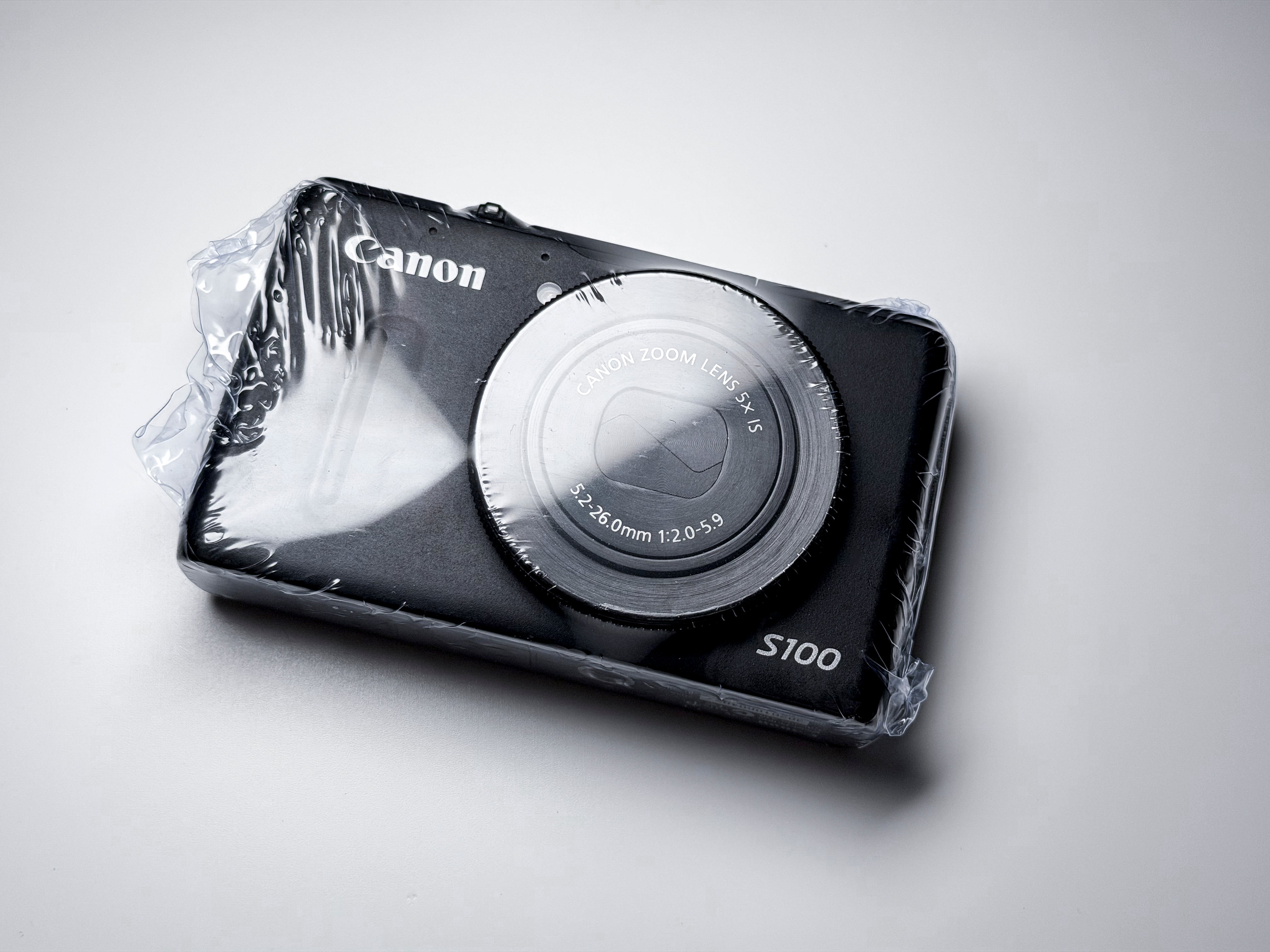 Canon S100 Powershot Digital Camera 5X Zoom IS f/2 - 1 Year Warranty, Excellent